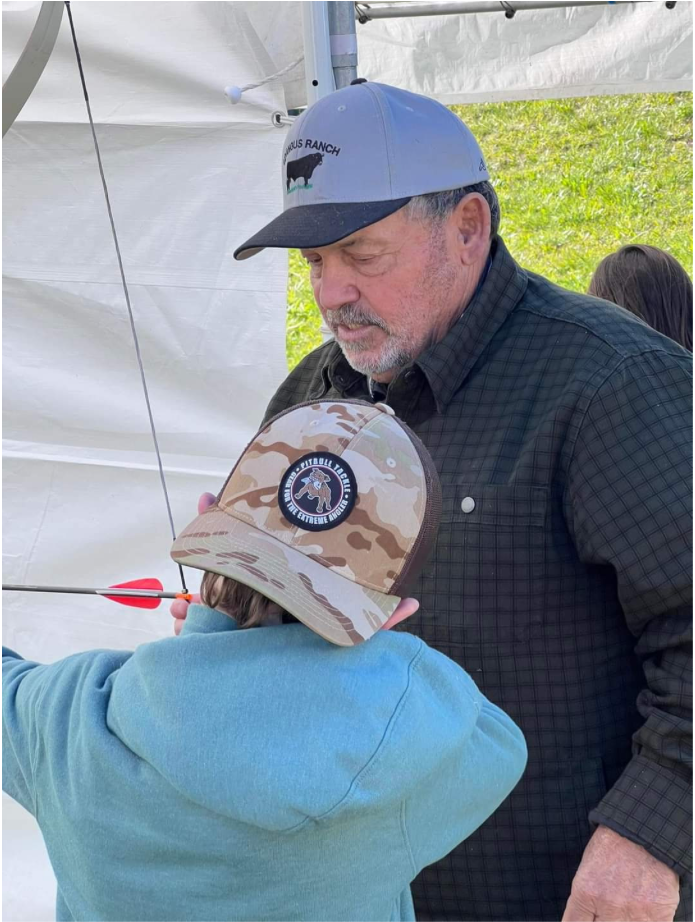 Steve Dutra helping with youth archery lessons (Photo by: Marilyn Dutra). 